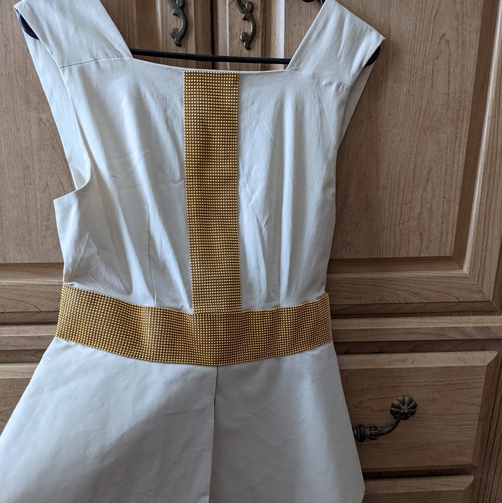 Beige and gold peplum style dress